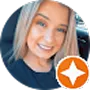 A smiling young woman with blonde hair